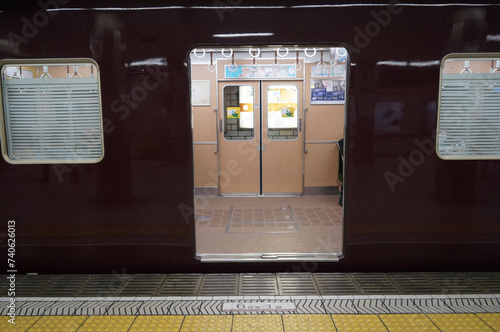 The Hankyu train or Osaka Express train stop at a subway station in Osaka, Japan. photo