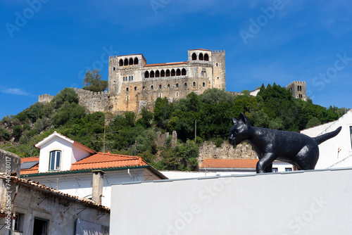 View of the castle of Leiria and the famous black cat of the city in a sunny day. Portugal. photo