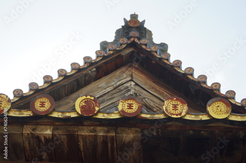 The roof detail of Senjokaku Pavilion (Hall of One Thousand Tatami Mats) is the largest structure on Miyajima Island in Hiroshima, Japan. photo