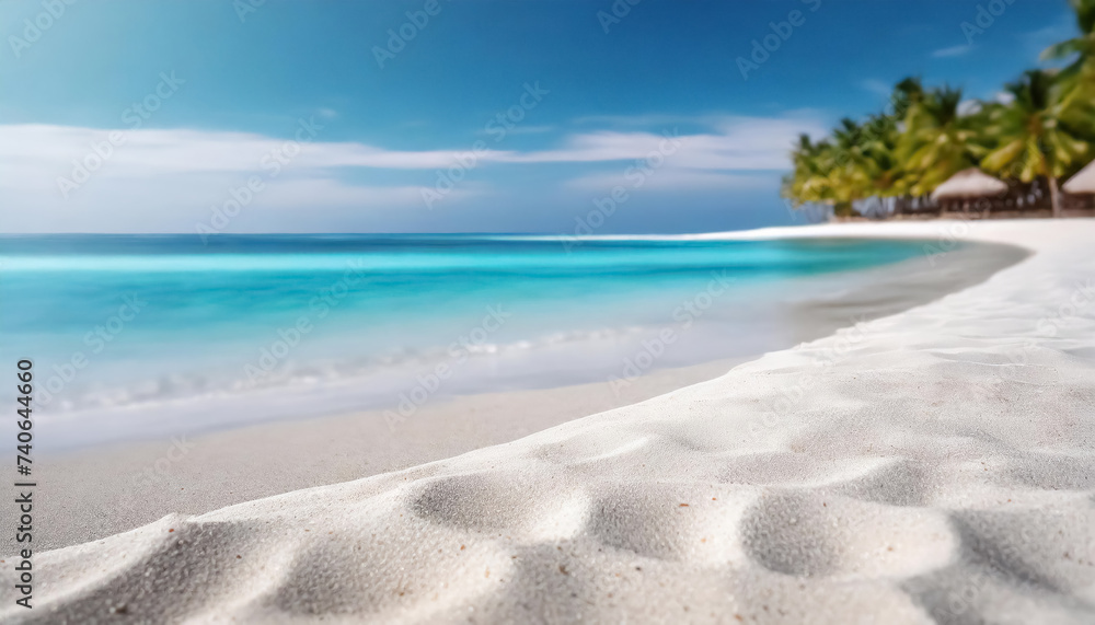 Obraz premium Pristine white sandy beach meets tranquil turquoise ocean under a serene blue sky with lush greenery