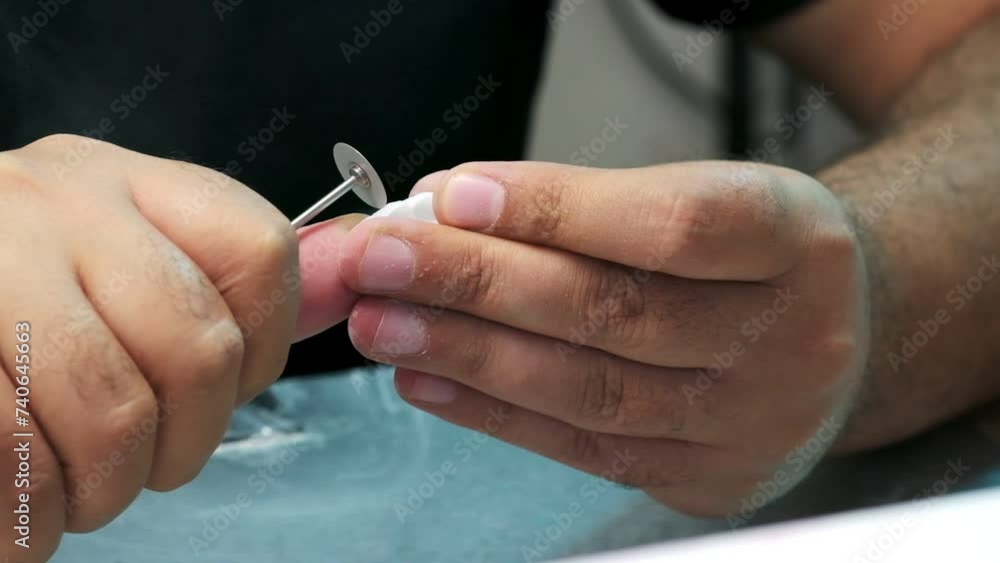 A meticulous close-up of porcelain tooth refinement in a dental lab A meticulous close-up of porcelain tooth refinement in a dental lab
