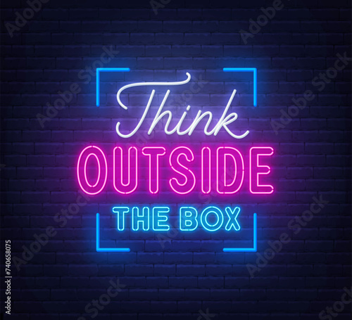 Think outside the box - neon lettering on brick wall background