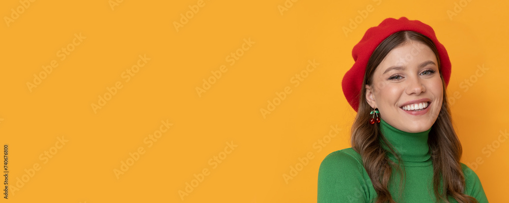 Beautiful young woman in a red beret and green turtleneck. Beautiful young woman in a red beret and green turtleneck.