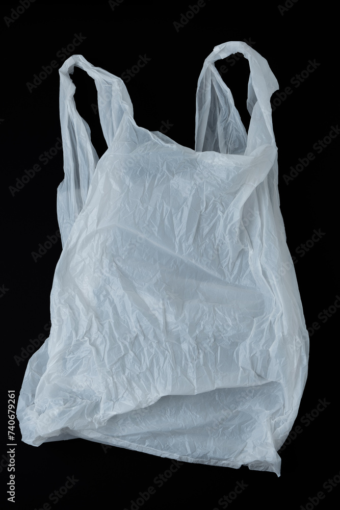 White plastic bag on black background