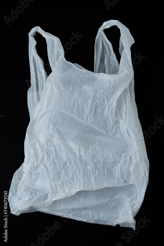 White plastic bag on black background