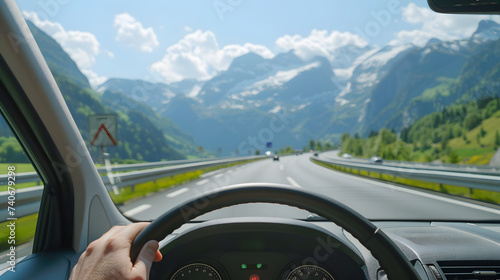 Male hands of car driver on steering wheel. Road trip  driving on highway road