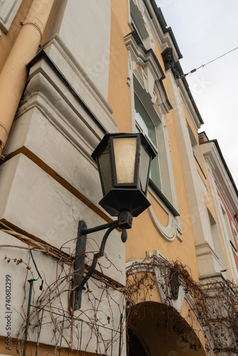 St. Petersburg, Russia, February 4, 2024. Vintage lantern on the facade of an old house.