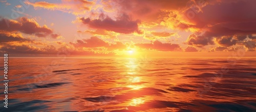 As the sun dips below the horizon, the sky transforms into a canvas of amber and orange hues. The afterglow reflects off the fluid water, creating a stunning natural landscape © TheWaterMeloonProjec