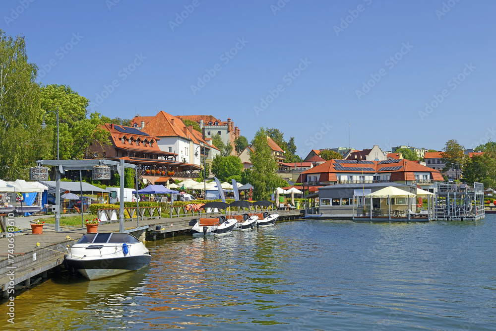 Lake Ryn embankment (Lake Rynskie) - Ryn is in heart of Masuria - an important tourist center, Warmian-Masurian Voivodeship in Poland