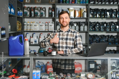 A salesman in an auto parts store. Retail trade of auto parts