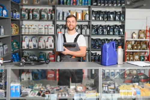 A salesman in an auto parts store. Retail trade of auto parts