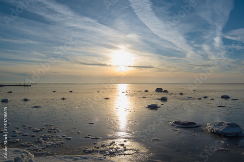 The Baltic Sea is frozen on a sunny day.