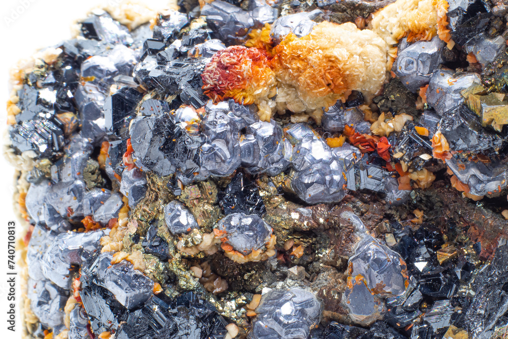 A raw cluster of pyrite, galena, limonite, calcite and sphalerite isolated on a white background surface macro. A variety of crystallised sulfide, hydroxide, iron and silicate minerals in matrix. A raw cluster of pyrite, galena, limonite, calcite and sphalerite isolated on a white background surface macro. A variety of crystallised sulfide, hydroxide, iron and silicate minerals in matrix.
