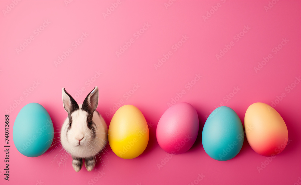 easter eggs and bunny in a line on pink background, cars with copy space