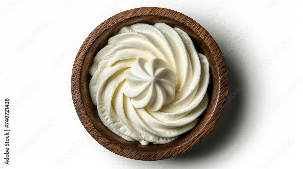 Sour cream in a wooden bowl isolated on white. Dairy product. Top view. Sour cream in a wooden bowl isolated on white. Dairy product. Top view.