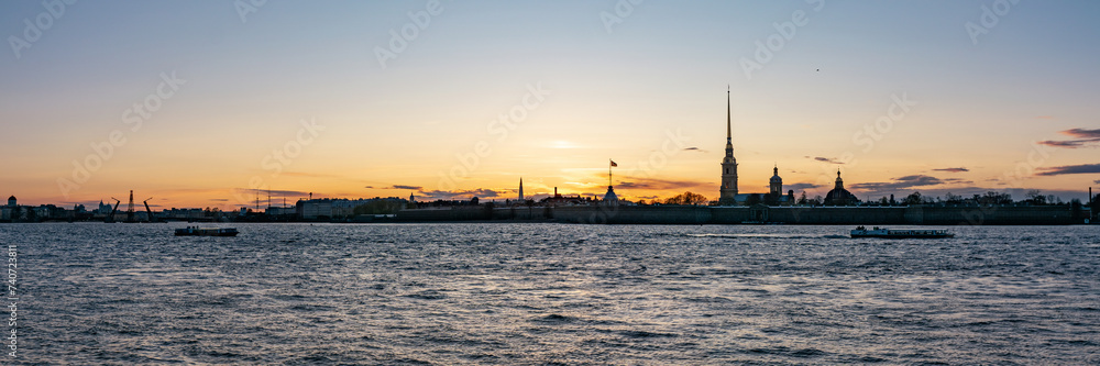 view from the palace embankment of the Peter and Paul Fortress at sunset