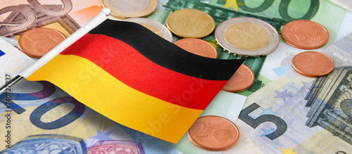 Euro banknotes and coins with German Flag