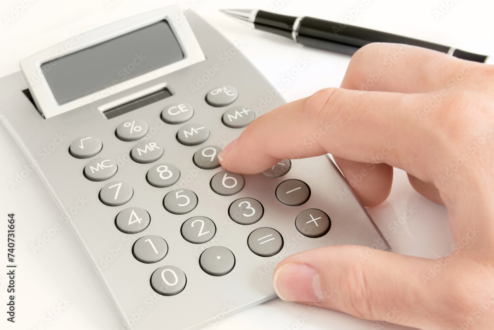 Male hand and calculator on white background Male hand and calculator on white background