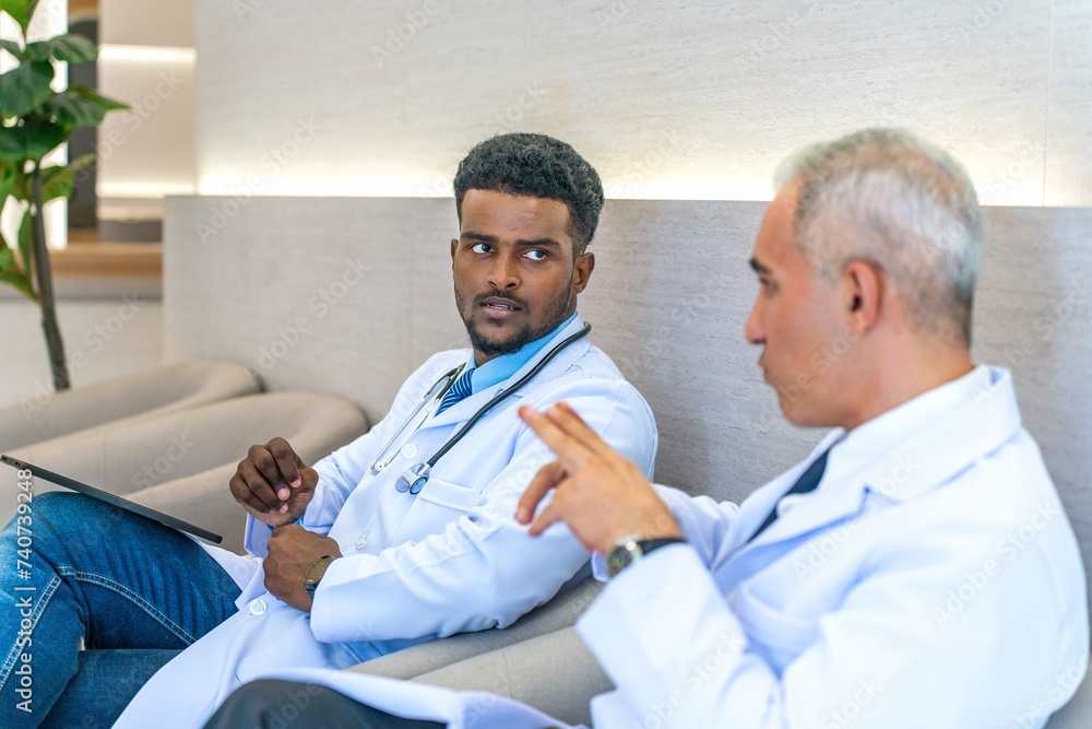 Two doctors sitting and talking