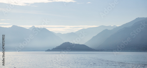 Lake surrounded by mountains on a sunny day, Lago di Como