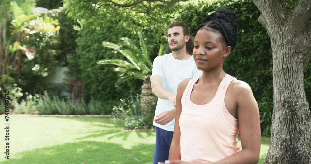 Young African American woman and young Caucasian man enjoying outdoor activities Young African American woman and young Caucasian man enjoying outdoor activities