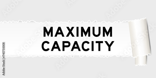 Ripped gray paper background that have word maximum capacity under torn part