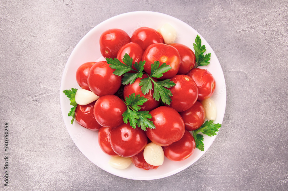 Image of red pizzcled canned tomatoes on a plate. Image of red canned tomatoes on a white plate Image of red pizzcled canned tomatoes on a plate. Image of red canned tomatoes on a white plate