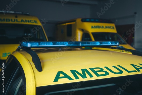 Ambulance cars ready for response in emergency medical service station..