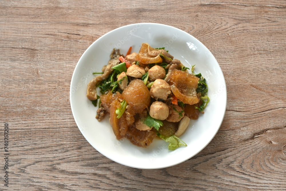 fried slice pork skin with pork meatball and mushroom on plate fried slice pork skin with pork meatball and mushroom on plate