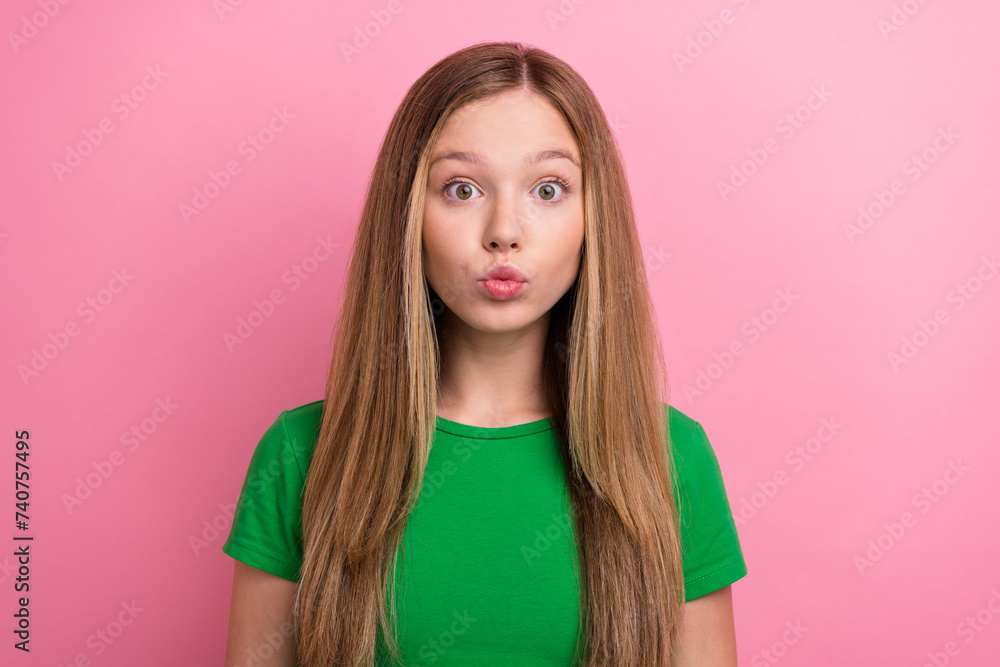 Photo portrait of pretty teenager girl pouted lips air kiss wear trendy green outfit isolated on pink color background Photo portrait of pretty teenager girl pouted lips air kiss wear trendy green outfit isolated on pink color background
