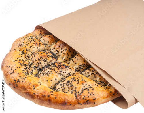 Traditional special Turkish bread called Ramazan Pide wrapped Kraft paper. Holy month Ramadan pita concept idea image. Isolated transparent png background. photo