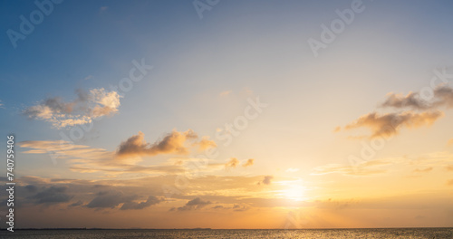 sunset sky over the sea in the evening with orange sunlight, Horizon sea landscape background 