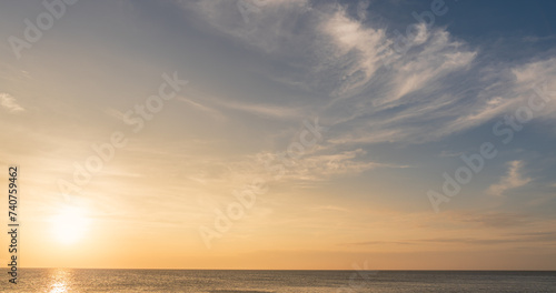 sunset sky over the sea in the evening with orange sunlight, Horizon sea landscape background  © Nature Peaceful 