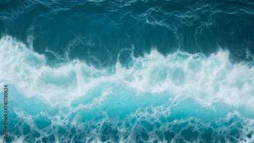 A blue ocean with waves and foamy 