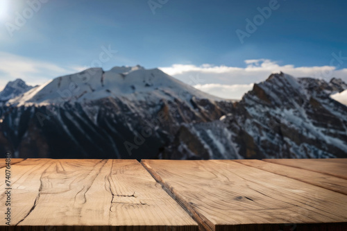 wooden table for display product, tables of wood for showing goods, empy surface, mountains landscape on the background © Alessandro