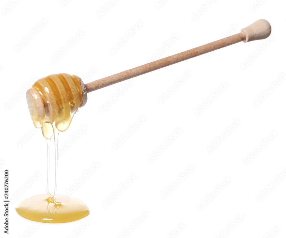 Natural honey dripping from dipper on white background Natural honey dripping from dipper on white background