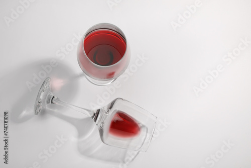 Tasty red wine in glasses isolated on white