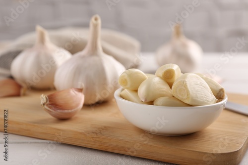 Fresh garlic on white wooden table, closeup