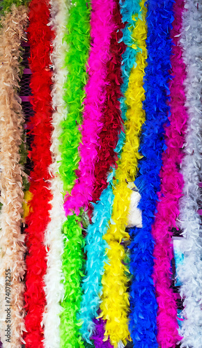 Colorful feather accessory scarves material sold outside on a market