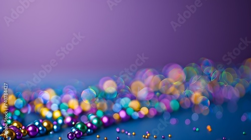 Beads on a purple background, suitable for design with copy space, Mardi Gras celebration.
