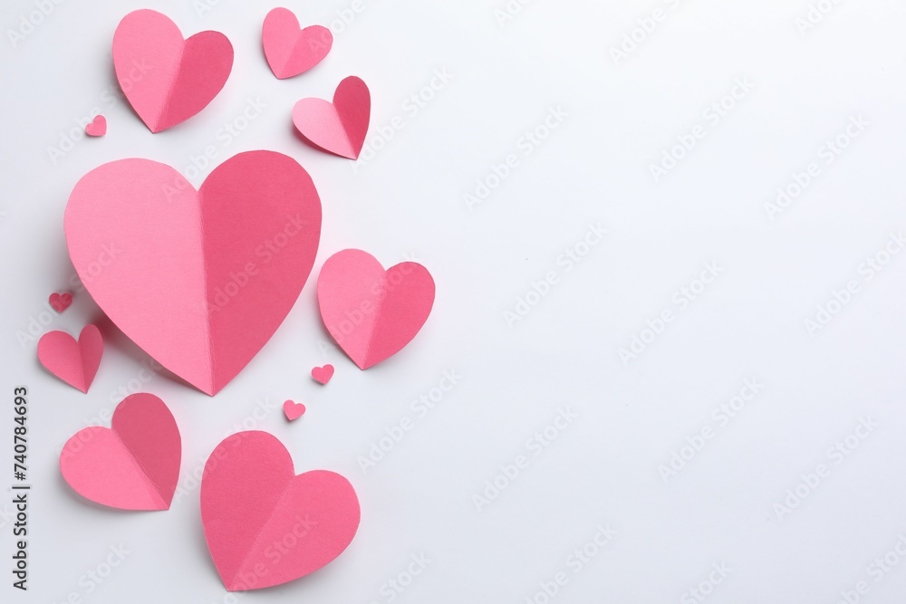 Pink paper hearts on white background, flat lay. Space for text Pink paper hearts on white background, flat lay. Space for text