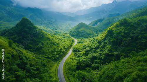 drone view road through lush green valleys. country road in field hill