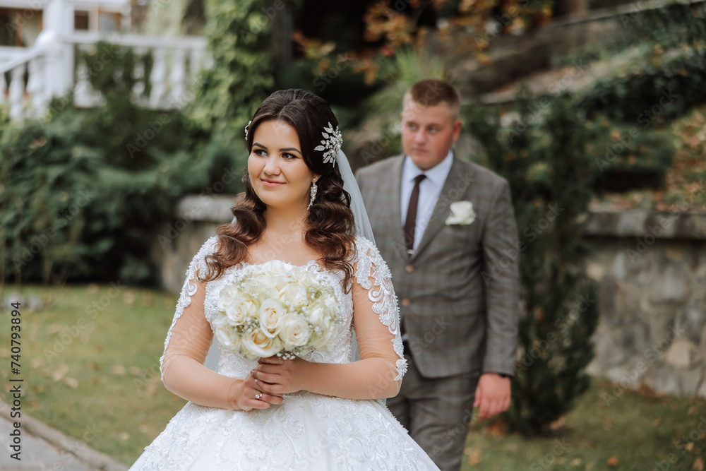 The moment of the first meeting of the bride and groom with a wedding bouquet, the bride is waiting for her lover. The moment of the first meeting of the bride and groom with a wedding bouquet, the bride is waiting for her lover.