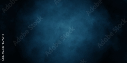 Abstract dark background grunge navy blue textrue. Blue stone grain background with copy space. vintage paper background with a dark blue vignette. night space view blue smoke cloud textrue.