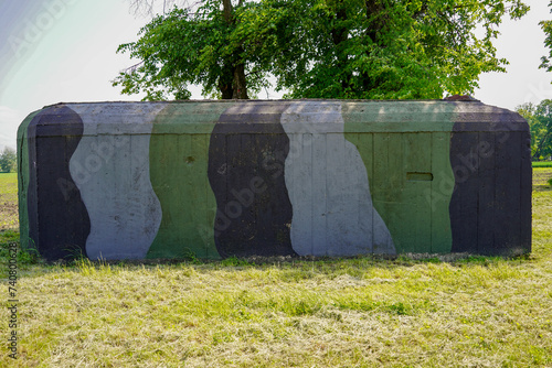 military bunker painted in camouflage pattern in Medyka village photo