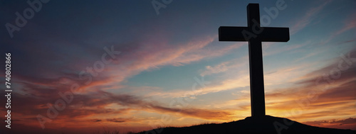 Spiritual silhouette - Jesus Christ's Cross against the backdrop of a captivating sunset sky.