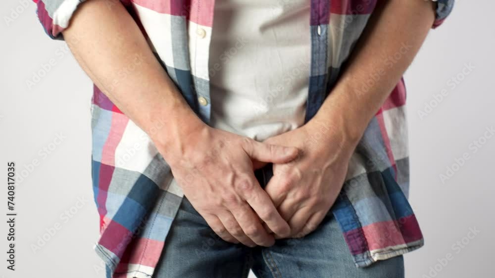 Man Pee His Pants, close-up. A man suffering from pain in the pelvic organs Man Pee His Pants, close-up. A man suffering from pain in the pelvic organs
