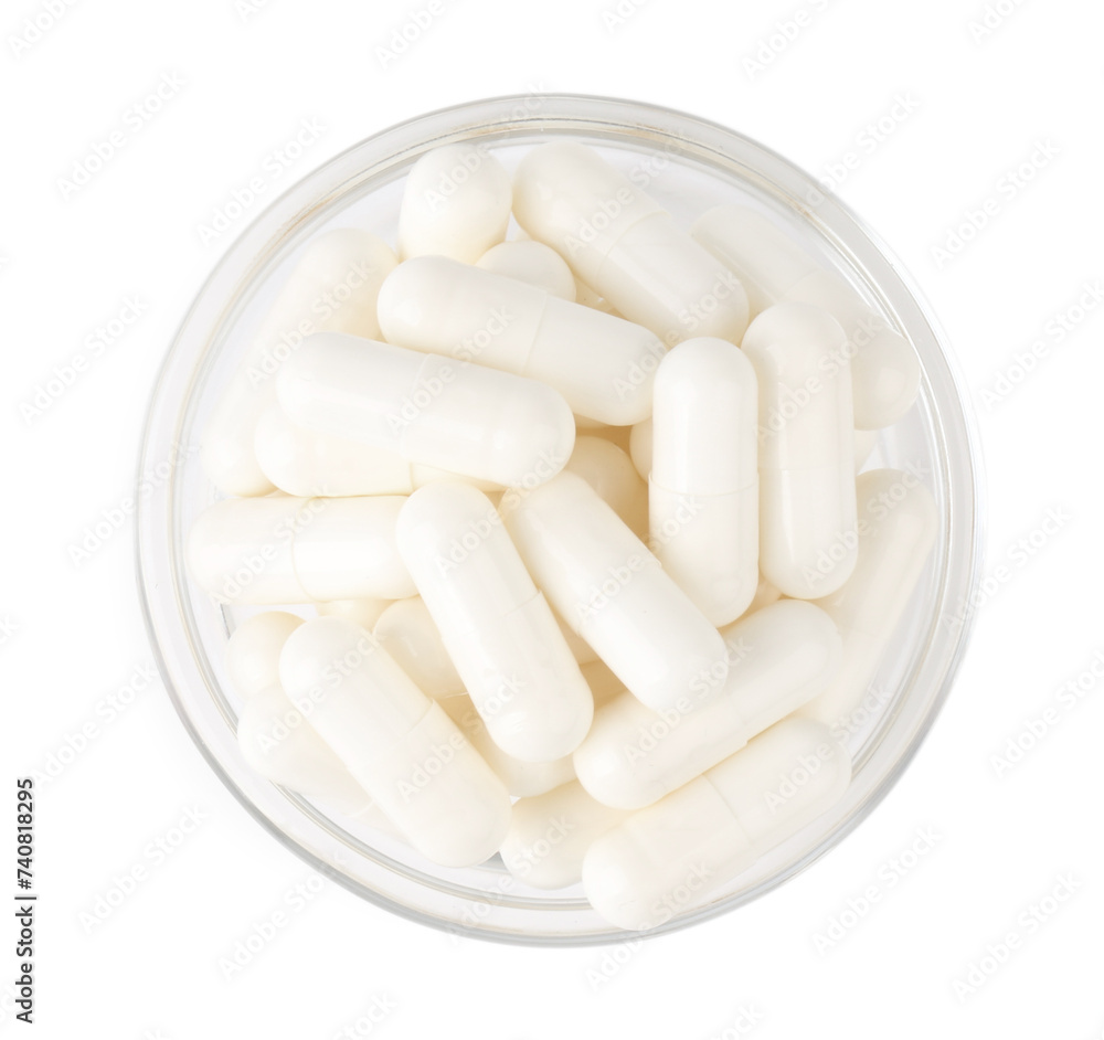 Vitamin capsules in glass bowl isolated on white, top view Vitamin capsules in glass bowl isolated on white, top view