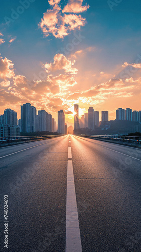 Asphalt road and city skyline at sunset in Shanghai China .