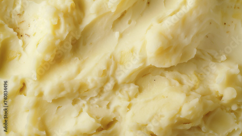 Tasty mashed potatoes as background, closeup. Seasoned mashed potatoes viewed from above